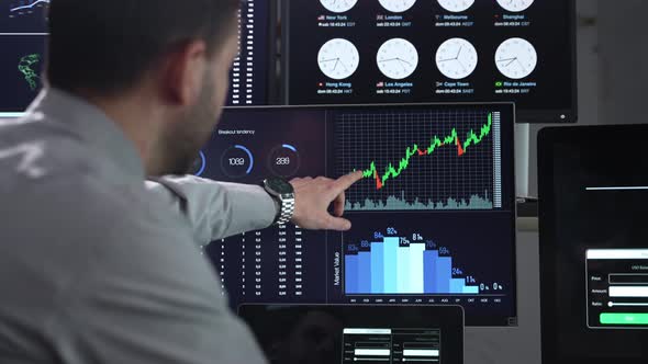 Business Data Analysts Working in Office with Stock Market Investment Trading Analytics on Computer