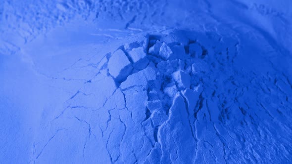 Crumbling Blue Powder Material Closeup Shot