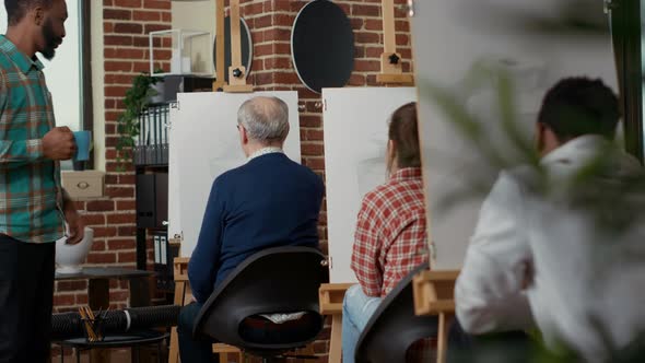 Young Person Talking to Elder Man About Vase Drawing