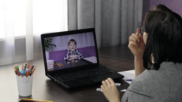 Woman Teacher Making Video Call on Laptop with Little Pupil. Distance Education