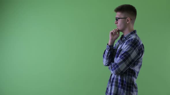 Profile View of Happy Young Hipster Man Thinking