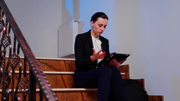 Company Manager Reading From Tablet Deadline