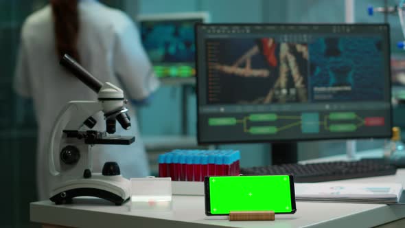 Microbiologist Putting Blood Sample Near Green Screen Phone