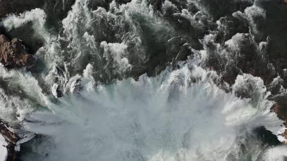 Aerial View of Godafoss Waterfall with Snowy Shore and Ice, Iceland, Winter