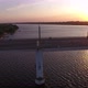 Aerial Shot of a Big Bridge at Pink Sunset From a Drone Moving Along in Summer - VideoHive Item for Sale