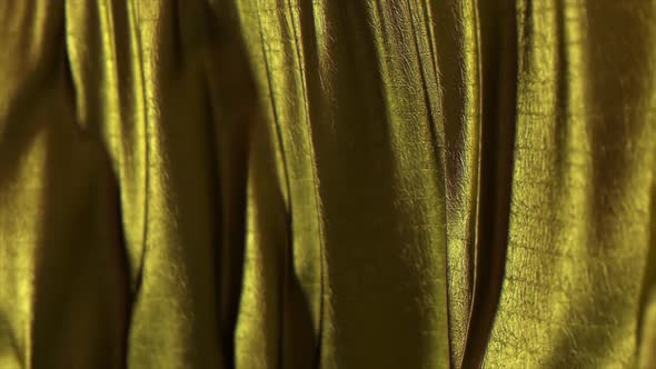 Folds of Golden Fabric Sway in the Wind