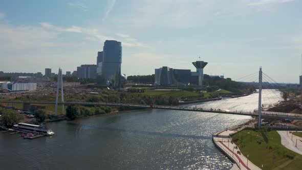 a Huge Modern White Pedestrian Bridge Across the River Against the Backdrop of the Moscow Region