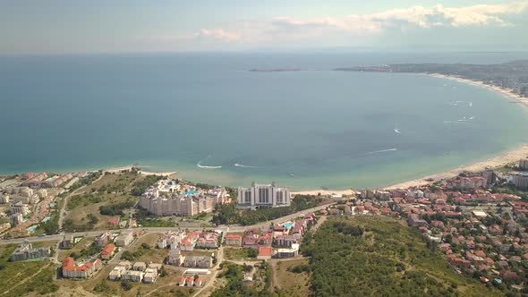 Aerial view of Sunny Beach city that is located on Black Sea shore. Top view of sand beaches with