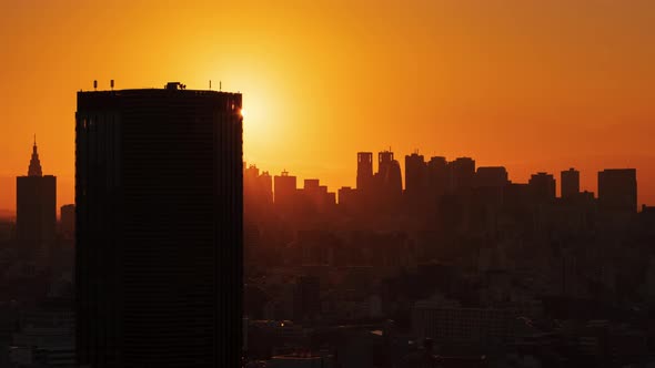 Timelapse aerial view of Tokyo skylines and skyscrapers buildings in Shinjuku at sunset, Japan 