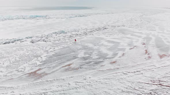 Aerial View Ice Field and Cracks at Frozen Lake