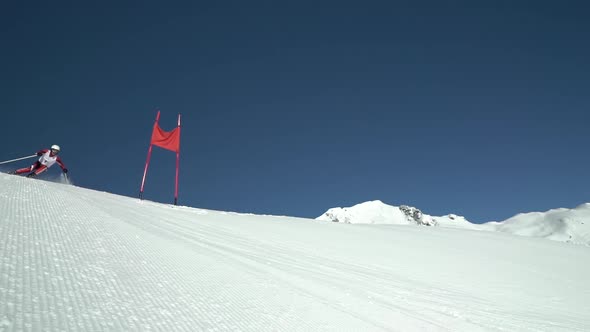 Slow Motion Professional Skier in Race Suit Skiing Giant Slalom