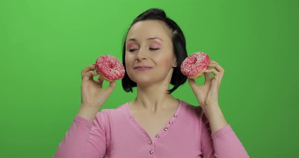 Happy Beautiful Young Girl Posing and Having Fun with Donuts. Chroma Key