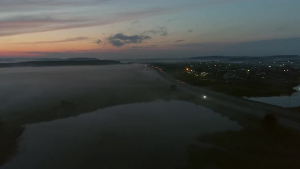 Aerial view of Cars drive on the night highway 11