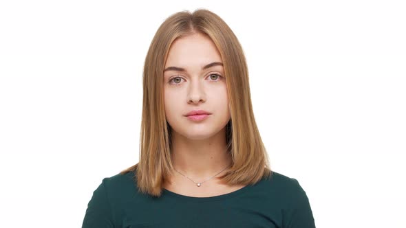 Portrait of Lovely Woman with Golden Straight Hair Posing at Camera with Kind Relaxed Look Being