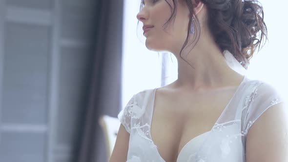 Motion From Nice Bride in White Lacy Dress Breast To Face