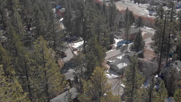 Drone revealing snowy mountain of Big Bear in California