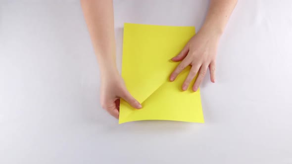 Hands Make Origami. White. Time Lapse