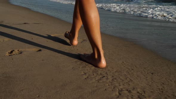 Attractive woman walking along the beach in Southern California