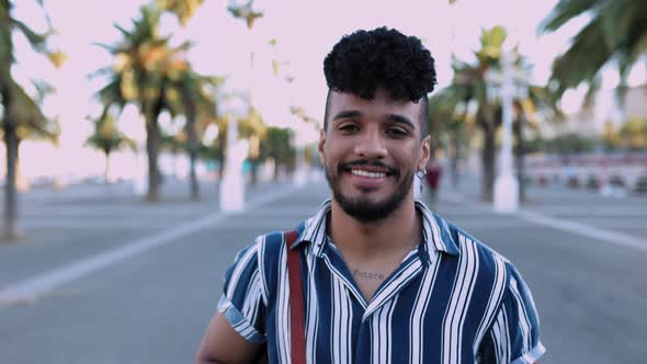 Confident Young African American Man Walking Outdoor in Summer