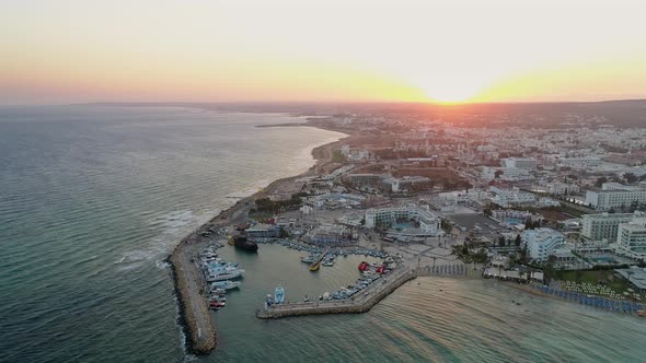 Aerial View of Pier in Summer Seaside City - Cinematic shot during Sunset