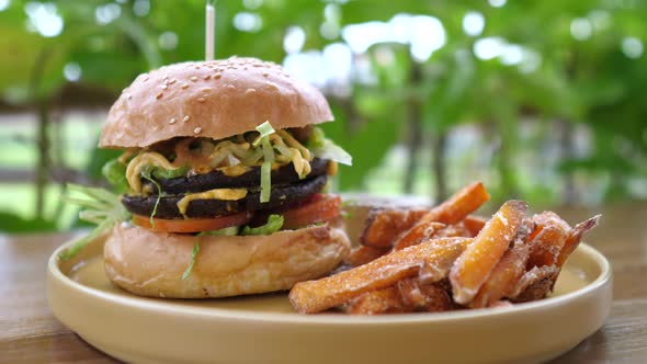 Close Up of Healthy Delicious Vegan Burger Served with Sweet Potato Fires