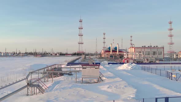 A Drone Flies Over an Oil and Gas Refinery in Winter