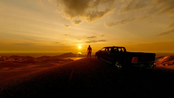 Man Watching Sunset With His Truck On The Top Of The Mountain