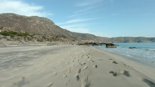 AERIAL: Kedrodasos beach near Elafonissi beach on Crete island with azure clear water, Greece, Europ