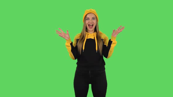 Modern Girl in Yellow Hat with Shocked Surprised Wow Face Expression Is Rejoicing. Green Screen