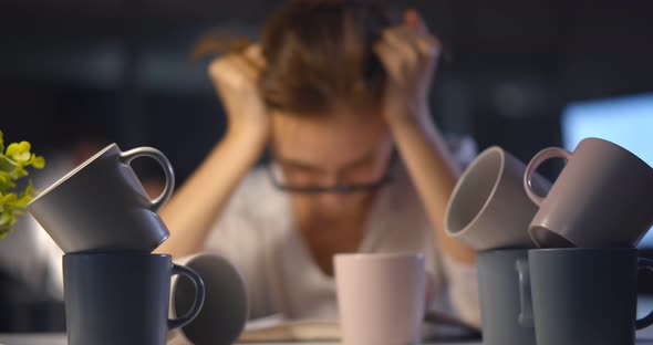 Stressed Exhausted Woman Sitting at Office Desk and Working Overtime Falling Asleep