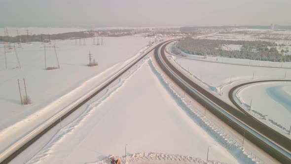 Interchange with a Road Bridge in Winter Aerial View