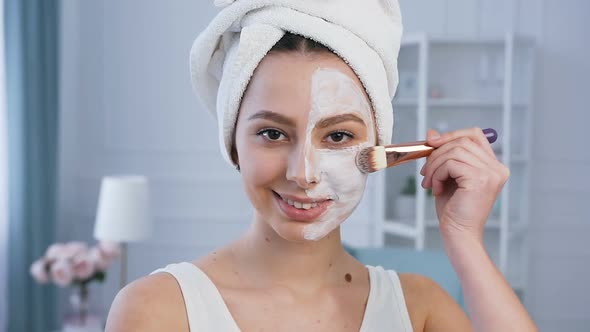 Portrait of Handsome Woman Applying Mask on the Face