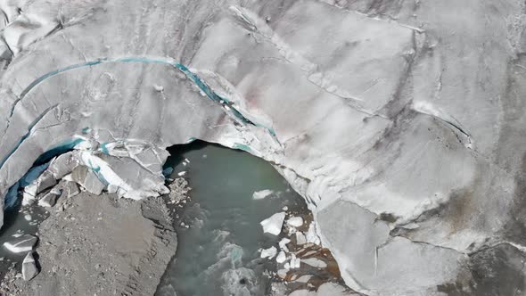 Aerial: terminus of glacier, end of glacier melting and breaking, global warming