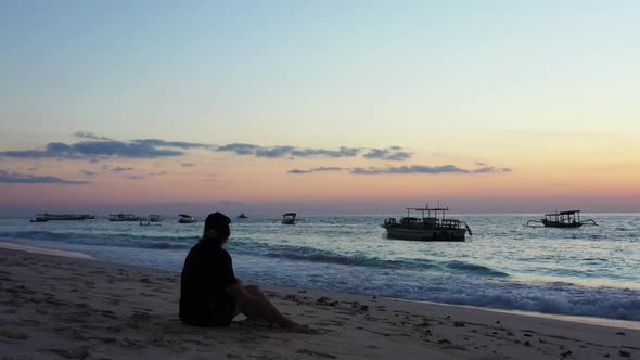 Girl suntans on beautiful resort beach break by blue lagoon and white sand background of the Maldive