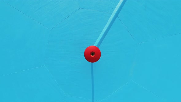 Aerial view of empty pool with blue background.