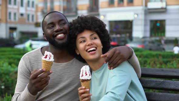 Happy Boyfriend and Girlfriend Laughing on Bench, Romantic Date With Ice-Cream