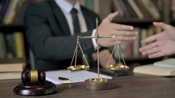 Close Up Shoot of Judge Hand Shaking with Other Person in Table