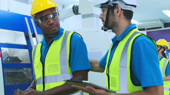 Professional engineering walking discuss inspecting with engineer team in clean room