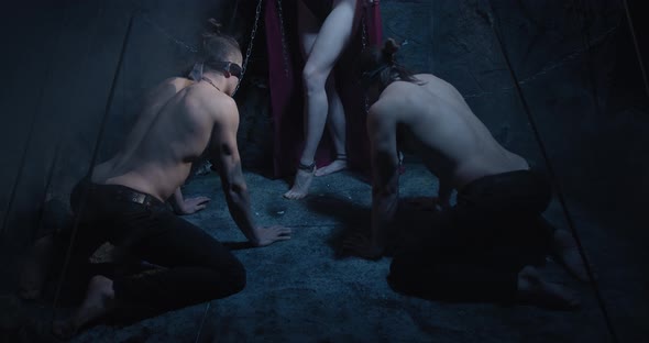 Succubus with Horns on Her Head Is Screaming at Men on Their Knees Film Grain