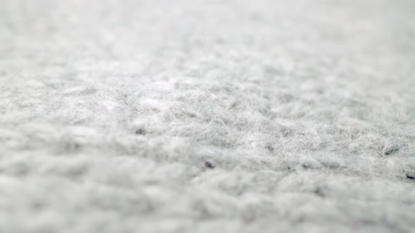 Extreme Detail View of Sheep Wool Cloth Texture Flowing in Macro Dolly Shot