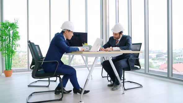 Engineer and Architect Meeting at Office Table