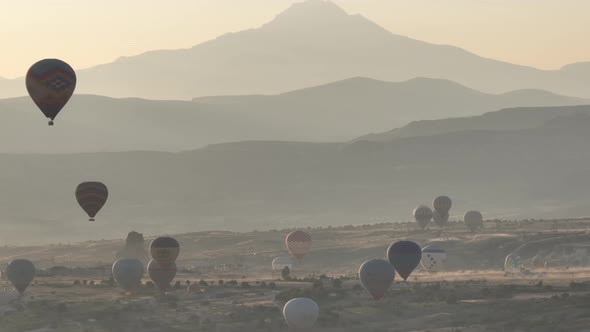 Aerial View of Natural Rock Formations in the Sunset Valley with Cave Houses in Cappadocia Turkey