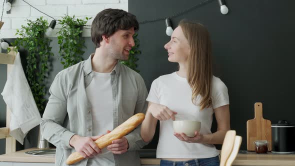 Romantic Young Couple Cooking Together in the Kitchenhaving a Great Time Together