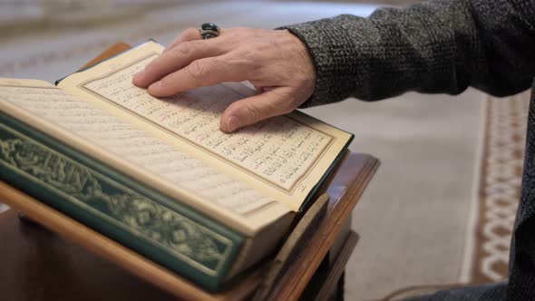 Fingers Follow Quran Page
