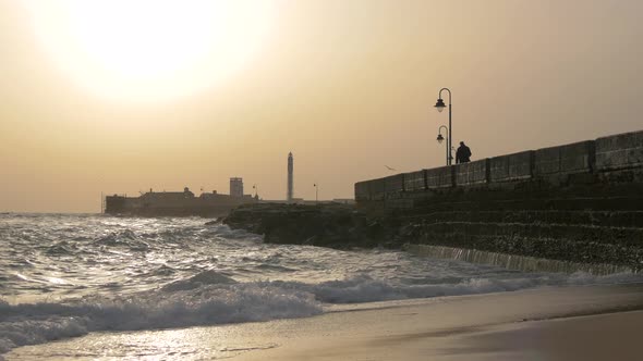 Waves crashing into a pier