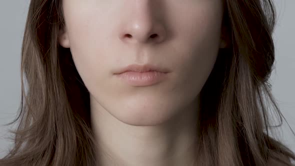 Young Woman Closes Nose Because of a Bad Smell