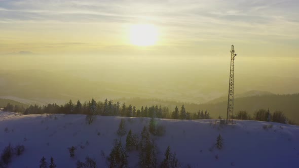 Flying Over Radio Communications Tower Mountain Snow Covered Winter Landscape
