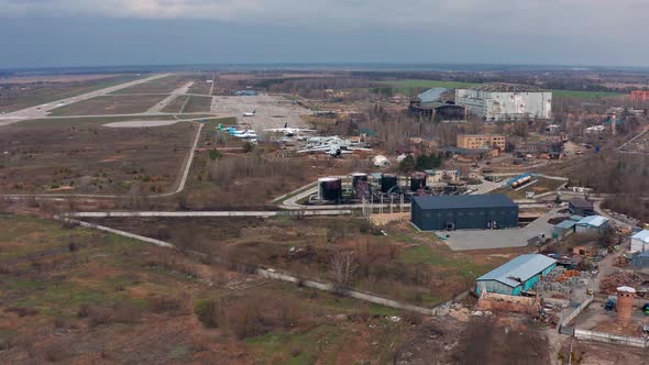 Top view of the airport in Gostomel. Burnt planes and fuel tanks. Russian war crime.