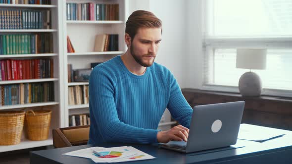 Thinking man working on new project remotely at office