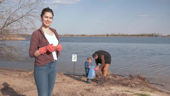 Environmental Solutions, Portrait of Happy Female Volunteer Giving Positive Gesture on Unfocused